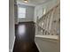 Entryway features hardwood floors and a staircase leading to the upper level of the home at 621 Jack Pine Ct, Indianapolis, IN 46224