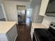 Well-lit kitchen with stainless steel appliances and center island featuring white countertops at 621 Jack Pine Ct, Indianapolis, IN 46224