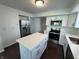 Updated kitchen with stainless steel appliances, center island, and ample cabinet space at 621 Jack Pine Ct, Indianapolis, IN 46224