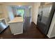 Modern kitchen area with stainless steel appliances and a view to the outdoor patio area at 621 Jack Pine Ct, Indianapolis, IN 46224