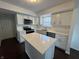 Modern kitchen featuring stainless steel appliances, white cabinets, quartz countertops, and a kitchen island at 621 Jack Pine Ct, Indianapolis, IN 46224