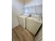 Laundry area with a washer, dryer, and wire shelving for storage and organization at 621 Jack Pine Ct, Indianapolis, IN 46224