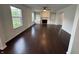 Spacious living room with hardwood floors, fireplace with built-ins, and natural light streaming through the windows at 621 Jack Pine Ct, Indianapolis, IN 46224