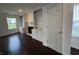 Open living area featuring hardwood floors, built-in shelves, and abundant natural light at 621 Jack Pine Ct, Indianapolis, IN 46224