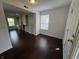 Bright living room featuring hardwood floors, natural light, and an open floor plan at 621 Jack Pine Ct, Indianapolis, IN 46224