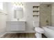 Modern bathroom featuring floating vanity, updated fixtures, and stylish tile surround at 6307 Broadway St, Indianapolis, IN 46220