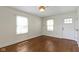 Inviting living room featuring hardwood floors, natural light, and neutral paint at 6307 Broadway St, Indianapolis, IN 46220