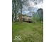 A wide backyard with a well-kept lawn and a deck at 650 Balroyal Ct, Indianapolis, IN 46234
