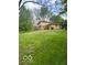 Backyard and detached garage with a brick exterior at 650 Balroyal Ct, Indianapolis, IN 46234