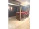 Finished basement bar area with barrel themed bar stools and wood paneled walls at 650 Balroyal Ct, Indianapolis, IN 46234