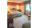 Comfortable bedroom with carpeting, a window with curtains, and decorative accents at 650 Balroyal Ct, Indianapolis, IN 46234