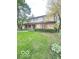 Charming two-story brick home with a well-manicured lawn and mature trees at 650 Balroyal Ct, Indianapolis, IN 46234