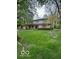 Charming two-story home with manicured lawn and mature trees at 650 Balroyal Ct, Indianapolis, IN 46234
