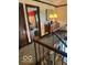 Hallway featuring wood trim, a decorative accent table, and carpeted floor at 650 Balroyal Ct, Indianapolis, IN 46234