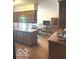 Traditional kitchen with wood cabinets, butcher block countertops, and a view to the dining area at 650 Balroyal Ct, Indianapolis, IN 46234