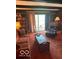 Living room with wood paneled walls, built-in bookshelves, and comfortable seating at 650 Balroyal Ct, Indianapolis, IN 46234