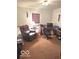 Home office with a computer desk, comfortable chair, and carpeted floor at 650 Balroyal Ct, Indianapolis, IN 46234
