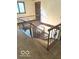 Carpeted stairs with dark stained wood railing at 650 Balroyal Ct, Indianapolis, IN 46234