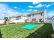 Spacious backyard features well-maintained grass, play areas, and a patio at 6827 Fallen Leaf Dr, Whitestown, IN 46075