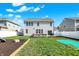Well-maintained backyard with lush grass, patio, and play area, perfect for Gathering fun at 6827 Fallen Leaf Dr, Whitestown, IN 46075