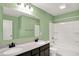 Modern bathroom featuring double sinks, vanity, and a shower and tub combination at 6827 Fallen Leaf Dr, Whitestown, IN 46075