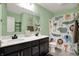 Bathroom features a double sink vanity and shower with a fun animal-themed curtain at 6827 Fallen Leaf Dr, Whitestown, IN 46075