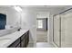 Bathroom featuring a double sink vanity, quartz countertop, and a stand up shower at 6827 Fallen Leaf Dr, Whitestown, IN 46075