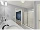 Bathroom featuring a double sink vanity, quartz countertop, and a stand up shower at 6827 Fallen Leaf Dr, Whitestown, IN 46075