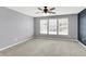Spacious bedroom featuring a ceiling fan, plush carpet, and plenty of natural light at 6827 Fallen Leaf Dr, Whitestown, IN 46075