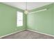 Bedroom with light green walls and a star shaped hanging light fixture at 6827 Fallen Leaf Dr, Whitestown, IN 46075