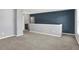 Spacious bonus room features plush carpet and neutral paint at 6827 Fallen Leaf Dr, Whitestown, IN 46075