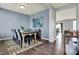 Charming dining room featuring a table set for six, wood floors, and an open layout at 6827 Fallen Leaf Dr, Whitestown, IN 46075