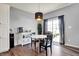 Dining area with modern lighting and sliding door access to the backyard at 6827 Fallen Leaf Dr, Whitestown, IN 46075