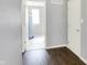 Hallway showing entry to laundry area with a water heater and a nearby door at 6827 Fallen Leaf Dr, Whitestown, IN 46075