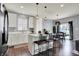 Bright kitchen with white cabinets, a center island, stainless steel appliances, and an open layout at 6827 Fallen Leaf Dr, Whitestown, IN 46075