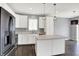 Modern kitchen featuring stainless steel appliances, white cabinets, and an island at 6827 Fallen Leaf Dr, Whitestown, IN 46075