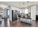 Modern kitchen with white cabinetry, stainless steel appliances, a central island, and pendant lighting at 6827 Fallen Leaf Dr, Whitestown, IN 46075