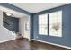 Living Room featuring a staircase, hardwood floors, and many windows for natural light at 6827 Fallen Leaf Dr, Whitestown, IN 46075