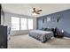 Spacious main bedroom features a large window and a stylish accent wall at 6827 Fallen Leaf Dr, Whitestown, IN 46075