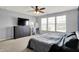 Bright bedroom features a large window, dresser, and tv at 6827 Fallen Leaf Dr, Whitestown, IN 46075