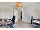 Bright office space features neutral walls, desk, and stylish wicker light fixture at 6827 Fallen Leaf Dr, Whitestown, IN 46075