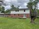 Brick two story home with spacious backyard and wooden deck at 7140 Avalon Trail Dr, Indianapolis, IN 46250