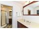 Elegant bathroom featuring a vanity, mirror, and a separate glass-enclosed shower at 7140 Avalon Trail Dr, Indianapolis, IN 46250