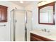 Well-lit bathroom featuring a glass door shower, vanity and a modern aesthetic at 7140 Avalon Trail Dr, Indianapolis, IN 46250