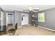 This room features gray walls, neutral carpet, a closet, and a ceiling fan at 7140 Avalon Trail Dr, Indianapolis, IN 46250
