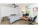 This bedroom features a ceiling fan, and a window for natural light at 7140 Avalon Trail Dr, Indianapolis, IN 46250