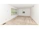 Bright, carpeted bedroom with ample natural light from two windows, creating a cozy and inviting space at 7140 Avalon Trail Dr, Indianapolis, IN 46250
