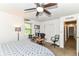 This bedroom features a ceiling fan, and a window for natural light at 7140 Avalon Trail Dr, Indianapolis, IN 46250