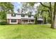 Inviting two-story home with a charming porch, well-manicured lawn, and attached garage, perfect for families at 7140 Avalon Trail Dr, Indianapolis, IN 46250