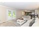 Inviting living room with patio access and a seamless flow into the updated kitchen at 7140 Avalon Trail Dr, Indianapolis, IN 46250